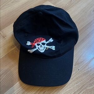 Black pirate skull baseball hat. Adjustable back